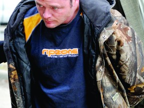 Jerry Hawley is led into the Brockville courthouse where he appeared for a bail hearing in this March 2010 file photo. Hawley is facing a second-degree murder charge in the 2008 death of his brother. (RECORDER AND TIMES FILE PHOTO)