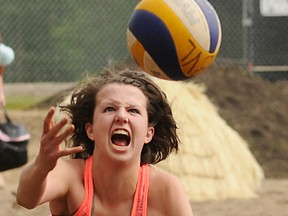 TERRY FARRELL/DAILY HERALD-TRIBUNE
Ashley McDiarmid of the team I'd Hit That dives for the ball at the annual Lu-WOW beach Volleyball Tournament held in Grande Prairie Alberta, June 22-24, 2012. This photo, taken by Terry Farrell, was voted the DHT’s top sports photo of 2012.