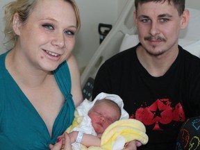 Valerie Pelky and Shawn Kelly pose with their newborn daughter, Peyton, at St. Joseph’s General Hospital in Elliot Lake Jan 2, one day following Peyton’s unexpected arrival.