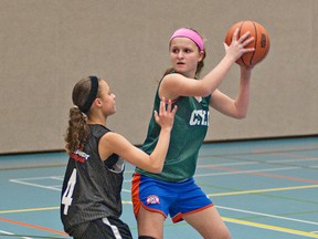 BRIAN THOMPSON, The Expositor

Stephanie Pongracz looks to pass the ball under defensive pressure from Alaina McMillan during a CYO Falcons bantam girls basketball practice on Wednesday evening at Ryerson Heights School. The team is preparing for this weekend's CYO Girls 23rd annual basketball tournament.