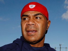 New England Patriots Junior Seau speaks to reporters ahead of their NFL game against Tampa Bay Buccaneers in London in this file photo taken October 23, 2009. Seau, who committed suicide last year, had a debilitating brain disease, likely from 20 years of hits to the head, ABC News and ESPN reported on Thursday, citing researchers and his family as sources. (REUTERS/Luke MacGregor/Files)