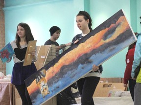 Students from the Creative Arts Focus Program at QECVI begin setting up their winter exhibit of fine art and design in a vacant store at 275 Princess St. Thursday morning. The show runs from Monday, Jan. 14 through Monday, Jan. 21.
Michael Lea The Whig-Standard