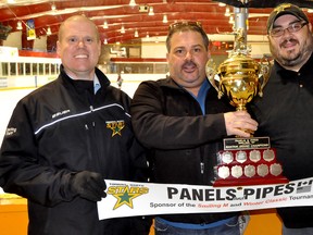 The 2013 edition of the Panels and Pipes Atom & Bantam Timmins North Stars Winter Classic hockey tournament has attracted 32 teams for three days of competition across the city. From left, Timmins Minor Hockey Association president Jamie Roach, Panels and Pipes owner J.P. Legault and TMHA board member Steven Vachon pose with the championship trophy.