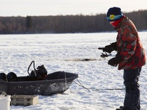 Tristan Rufiange, 12, enjoys a mild winter morning ice fishing with his grandfather Allan Rufiange on Swan Lake last week. This time of year is perfect for farmers and ranchers who like to fish as there are no crops to worry about and most cattle producers won’t begin calving until later. (Randy Vanderveen Special to Peace Country Sun)