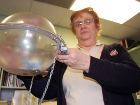 Donna Acre, community ministries coordinator with the Salvation Army in Tillsonburg holds one of the kettles used during the annual Christmas Kettle Campaign over the holidays. The campaign is the biggest fundraiser for the local non-profit organization every year, however with a shortfall this Christmas of approximately $10,000, Acre is concerned about the impact it will have on programs for the coming year in 2013. 

KRISTINE JEAN/TILLSONBURG NEWS/QMI AGENCY