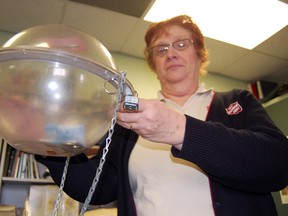 Donna Acre, community ministries coordinator with the Salvation Army in Tillsonburg holds one of the kettles used during the annual Christmas Kettle Campaign over the holidays. The campaign is the biggest fundraiser for the local non-profit organization every year, however with a shortfall this Christmas of approximately $10,000, Acre is concerned about the impact it will have on programs for the coming year in 2013.
KRISTINE JEAN/TILLSONBURG NEWS/QMI AGENCY