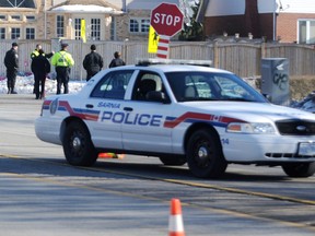 Police prepare Wednesday Jan. 9, 2013 to reenact a collision at Murphy Road and Cathcart Boulevard in Sarnia, Ont. Jillian Keck, 10, was killed when she was hit by a vehicle while crossing the intersection Monday. (TYLER KULA photo)