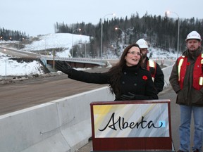 Mayor Melissa Blake motions to the Confederation Way interchange behind her during the official opening of the new overpass Nov. 7, 2012. TODAY FILE PHOTO