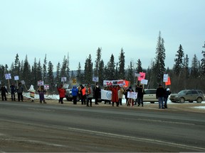 Protesters with the Idle No More movement block southbound traffic on Highway 63 Thursday. Protesters blocked traffic for no longer than two minutes and caused no serious traffic delays. VINCENT MCDERMOTT/TODAY STAFF