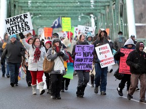 Idle No More protesters march across the Walterdale Bridge in Edmonton in December. Several protests and blockades similar to this one have taken place all over the country to raise awareness about the Federal government's Bill C-45. A second blockade on Highway 43, just outside of Valleyview will take place today. (David Bloom/ QMI Agency)