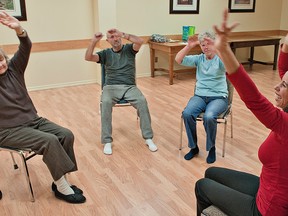 BRIAN THOMPSON, The Expositor

Fitness instructor Melanie Ely (right) leads Mimi Leskien (left), George Hatton and Joyce McAllister in a chair Zumba class on Thursday at the Brant County library in Paris.