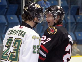 Tyler Prong, right, of the Sarnia Legionnaires gets a laugh out of St. Thomas Star Michael Lucifora after the whistle during the second period Thursday, Jan. 10, 2013 at Sarnia Arena in Sarnia, Ont. (PAUL OWEN, The Observer)