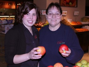 Pick of the Crop employees Breanna Cylbulski, left, and Yvonne C. Gauthier were on hand for the opening of the new grocery in Timmins Friday.