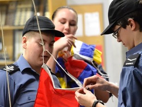 Master Seaman Wesley Marsh directs his squad as they encode a message using International Signal Flags. Marine Communication is but one of the skills that the cadets of Royal Canadian Sea Cadet Corps Tiger must practice as they prepare for the Interdivisional Seamanship Competitions in Sudbury next month.