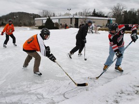 Members of 8 Wing/CFB Trenton participate in the air base's first annual Pond Hockey Classic in Batawa, north of Trenton, in January 2012. 
JEROME LESSARD/QMI AGENCY FILE PHOTO