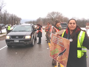 Delaware First Nation members turned out in large numbers Friday to staff an information picket on Longwoods Road in front of Fairfield Museum. Band members handed out free coffee and donuts to motorists and their passengers along with information on their IdleNoMore Indigenous Revolution. (BOB BOUGHNER, The Daily News)
