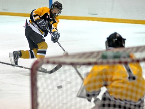 An Iroquois Falls Legion 70 skater beats Cochrane Bruins goalie Zack Lamothe in the third period of Friday's game at the Archie Dillon Sportsplex. Thirty-two teams are participating in the tournament, which lasts all weekend.