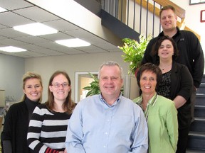 Rory Ring, front, is the new president and CEO of the Sarnia Lambton Chamber of Commerce. His staff includes, from left, marketing and events co-ordinator Cindy Scholten, operations assistant Shauna Carr, accounting and personnel administrator Diane Nadeau, information co-ordinator Ana Dailey and Adam Rose, director of membership development and sales. Jan. 12, 2013. CATHY DOBSON/ THE OBSERVER /QMI AGENCY
