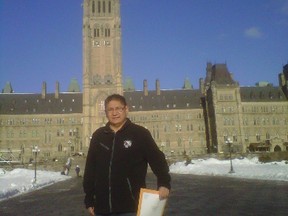 Shoal Lake 40 First Nation Chief Erwin Redsky stands before Parliament Hill in Ottawa on Thursday, holding a letter urging Prime Minister Stephen Harper to support the first nation in its troubled relationship with the City of Winnipeg over water extraction. 
HANDOUT PHOTO
