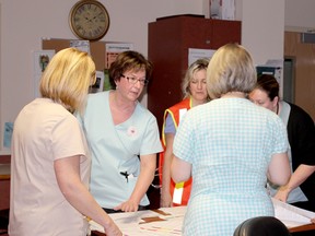 Registered nurses discuss a plan during a mock exercise at Riverview Gardens in Chatham Ont. on Friday Jan. 11, 2013. Shown from left to right are Joanne DeJong, Joan McLean, Lisa Shoopman, Anita Morton and Toni Elgie. (Contributed photo)