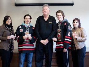 The Sarnia Legionnaires will hold three 'hospice nights' this month to aid the local resource centre for the terminally ill. Among other things, the club is donating tickets, which the hospice will sell to bolster its budget. Shown here are, from left: St. Joseph's Hospice executive director Monica Robson, Legionnaire player Davis Boyer, team GM Bob Williamson, player Josh Kestner and hospice fund development manager Maria Muscedere. (Submitted photo)