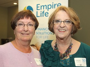 Ninety-nine years of service between them, Empire Life retirees Cheryl Osborne, left, and Dianne Faulkner talked about their experiences at the company during its 90th anniversary celebrations Friday afternoon.