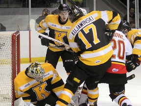 The loose puck bounces in front of Frontenacs goalie Mike Morrison while Belleville's Tyler Graovac and Kingston's Ryan Kujawinski look for the puck during Friday night's OHL game at the K-Rock Centre. (Michael Lea/The Whig-Standard)