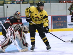 DARRY G. SMART, The Expositor

Whitby captain Jason McAuley tries to screen Brantford goalie Brett Leggat during Friday night's during Allan Cup Hockey game at the civic centre.