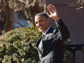 U.S. President Barack Obama waves in Washington, December 13, 2012. (REUTERS/Jason Reed)