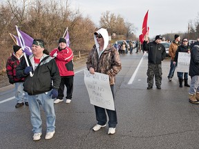 Native protesters blockade a section of Brant County Road 4 (Cockshutt Road) at Tutela Heights Road, on the southern edge of the city of Brantford, Ontario on Saturday morning, January 12, 2013.  The group, comprised mainly of residents from the nearby Six Nations Reserve arrived at about 8:00 a.m. and plan to remain until 5:00 p.m.  County of Brant OPP and Brantford Police have barricades in place to redirect traffic around the blockade.  Organizers say they want to raise awareness of federal government bills that violate their treaty rights and can impact all Canadians.
BRIAN THOMPSON/BRANTFORD EXPOSITOR/QMI Agency