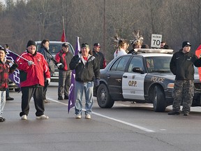 Native protesters blockade a section of Brant County Road 4 (Cockshutt Road) at Tutela Heights Road, on the southern edge of the city of Brantford, Ontario on Saturday morning, January 12, 2013.  The group, comprised mainly of residents from the nearby Six Nations Reserve arrived at about 8:00 a.m. and plan to remain until 5:00 p.m.  County of Brant OPP and Brantford Police have barricades in place to redirect traffic around the blockade.  Organizers say they want to raise awareness of federal government bills that violate their treaty rights and can impact all Canadians.
BRIAN THOMPSON/BRANTFORD EXPOSITOR/QMI Agency