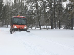 Lonny Kirkpatrick clears a path for a neighbour after Friday's snowstorm.
LLOYD MACK/Daily Miner and News