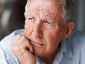 A senior man looking away in deep thought. (Fotolia.com)