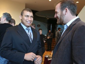 Veteran pitcher Ryan Dempster (right) talks with teenage slugger Josh Naylor of Mississauga on Saturday at a Baseball Canada findraiser and awards banquet in Toronto. (Veronica Henri, Toronto Sun)