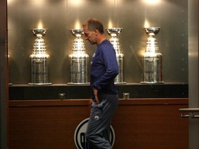 Edmonton Oilers head coach Ralph Krueger walks around the dressing room during a conditioning skate.  The Oiler players return to the ice at Rexall on Jan. 8.
Perry Mah/Edmonton Sun