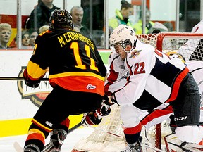 Bulls forward Joseph Cramarossa beats Windsor defenceman Nick Ebert wide around the net during OHL action Saturday night at Yardmen Arena. (Michael J. Brethour for The Intelligencer.)