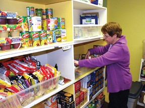 Brenda English, manager of the Vulcan County Food Bank, keeps the shelves organized Jan. 8. Although the food bank is doing well following the holidays, it always needs support from the community to stay well stocked. 
Simon Ducatel/Vulcan Advocate