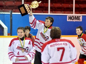 The Schumacher Northern Research Rebels blanked the Schumacher Goldcorp Sharks 3-0 in the Panels and Pipes Winter Classic Bantam 'A' final on Sunday at the Archie Dillon Sportsplex. Rebels captain Jay Chenier hoists the trophy as teammates Joe Thorne (No. 4) and Jared Rodgers celebrate.