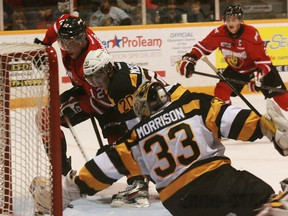 Frontenacs goalie Mike Morrison reaches out with his glove to make a save on Attack player Steven Janes in Owen Sound on Saturday.