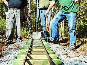 Frontenac Society of Model Engineers members (l-r) Ray Egerton, Fred Beeton and Phil Ibbotson take a break from building the track.
