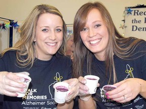 LAURA CUDWORTH The Beacon Herald
Kimberlee Hodder, left, and Amanda Long of the Alzheimer Society of Perth County hold up a delicious cold spiced blueberry soup at Soup's On Saturday.