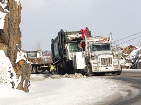 A truck was removed from the scene of an accident on Big Nickel Mine Road Monday morning. JOHN LAPPA/THE SUDBURY STAR/QMI AGENCY