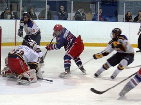 The Carruthers-Nichol Kincardine Bulldogs hosted the Wingham Ironmen on Friday, Jan. 11, 2013. With four new faces in the lineup, the Dogs would down the Ironmen by a final of 5-4. Cody Britton looks to get a stick on a rebound in the Wingham crease during third period action on Friday night.