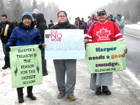About 50 members of Naotkamegwanning First Nation (Whitefish Bay) slowed traffic on Highway 71 to protest Bill C-45, which they say infringes on environmental protection and treaty rights. From left, Isobel White Daphne Prince and Leigh Green.
HANDOUT PHOTO