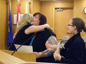 Women in Government participant Carrie Ottewell gets a hug from Coun. Nicole Nadeau while fellow participant Victoria Kelso looks on. The pilot project has now wrapped up.