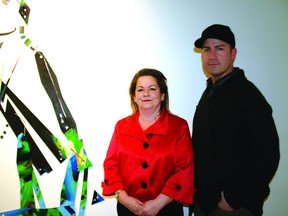 Jason Baerg stands with Gallery @501 curator Brenda Barry Bryne at the “Nomadic Bounce” exhibit, which runs until Feb 24. Leah Germain News Staff