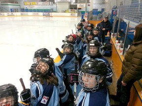 Lake of the Woods Girls Peewee Chaos are all smiles on their bench en route to winning the Kathy Sanders Memorial Tournament.
