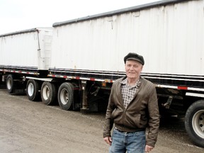 Don Arner, a Fletcher, ON, farmer, is out about $17,000 or a missing load of soybeans that left his farm in October. Arner, shown here Monday, Jan. 14, 2013, in front of a grain carrier similar to the one that took his load, said he's partly to blame for not keeping closer records but said he's heard of the same thing happening to other farmers. (BOB BOUGHNER, The Chatham Daily News)