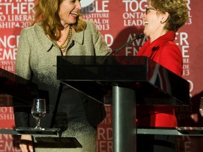 Leadership hopefuls Sandra Pupatello (left) and Kathleen Wynne share a laugh during the debate for the leadership of the Ontario Liberal Party held at the Ajax Convention Centre in Ajax, Ont  on Sunday Jan. 6, 2013.  (QMI Agency file photo)