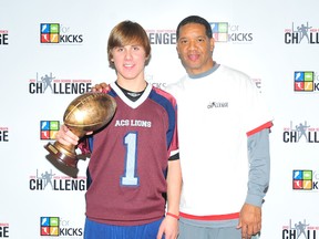 Submitted Photo

Liam Putt poses with former CFLer Damon Allen after Putt won the 2012 Damon Allen High School Quarterback Challenge.